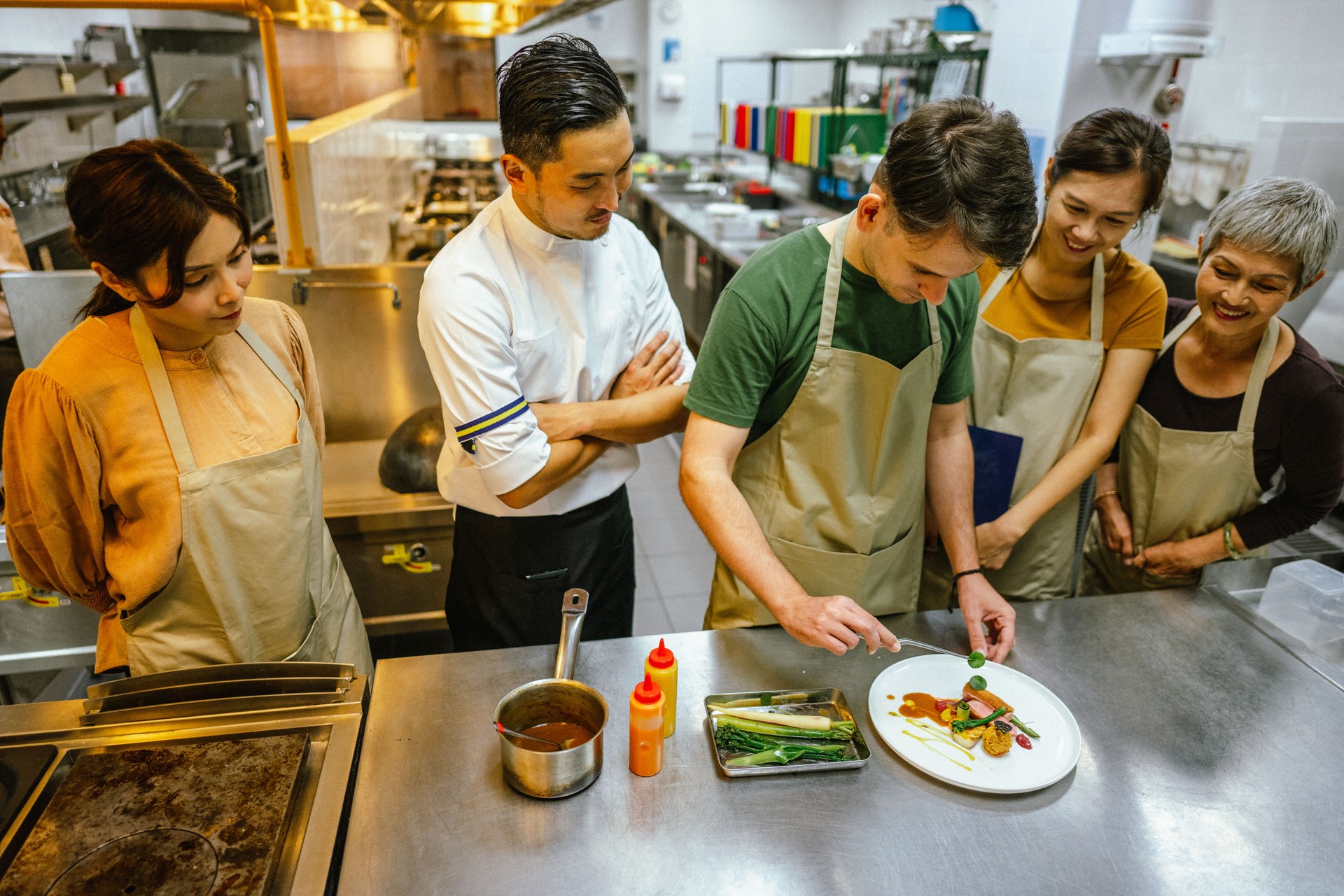 Creative Culinary Expression: Male Student Demonstrates Food Decoration Techniques